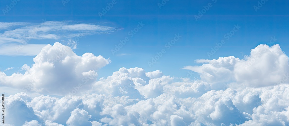 Poster blue skies filled with fluffy white clouds on a sunny day create a picturesque scene with a copy spa