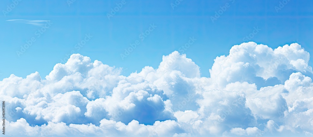 Poster The stunning array of clouds against a blue sky with copy space image.