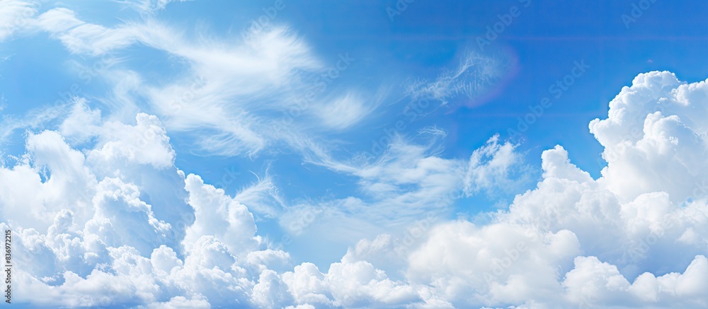 Aufkleber abstract style panorama with a backdrop of blue sky, white clouds, and copy space image.