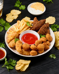 Chicken nuggets, Southern strips, Chicken fingers, french fries, chips, various sauces and beer