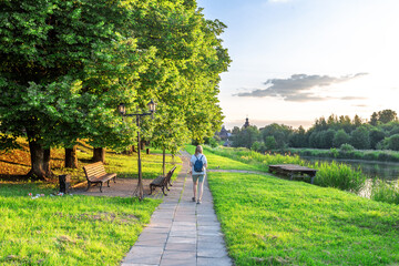 A summer evening. A park in Suzdal on the river bank. A quiet evening, a strolling girl, a mother...