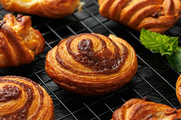 Mini danish pastry selection. Maple pecan plaits, cinnamon swirls and vanilla creme crowns