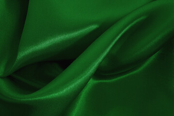 Green emerald fabric texture background, detail of silk or linen pattern.