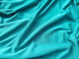 Cyan colored fabric texture and background