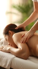 Obraz premium Peaceful Asian Woman Receiving Relaxing Back and Arm Massage on Therapy Table