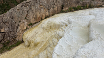 Travertines of Başkale, in Van province of Turkey, a small travertine with small amount of underground mineralized water, coloring the travertines
