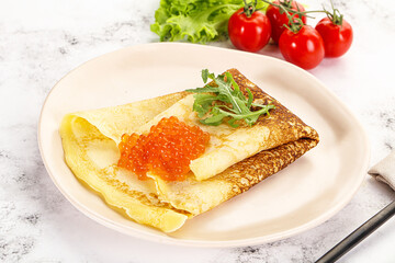 Russian pancake with red caviar