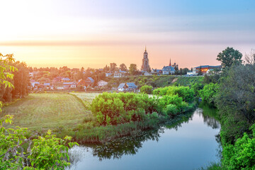 Fototapeta premium Suzdal, Russia, Golden Ring: The symbol of the city is the famous landmark of the Venerable Bell Tower of the Ordination Monastery in Summer.