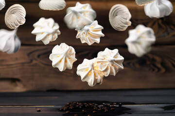 Fototapeta premium meringues on a wooden table