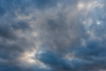 Dramatic cloudy sky with varying shades of blue and gray