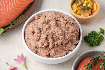 Wet dog food in a white cup