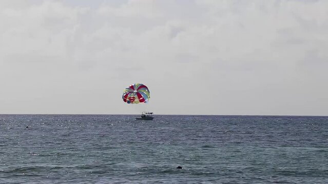 Paragliding with boat in the Caribbean in Mexico.