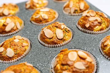 Beautiful and fresh homemade zucchini muffins. Food photography on white background.