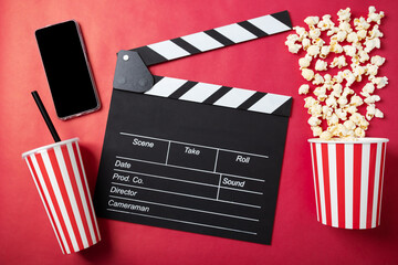 Cinema tickets online, Popcorn bucket with soda cup and clapper board with phone, online booking,...