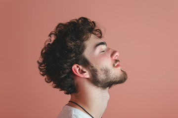 Fototapeta premium A close up of a man with beard and closed eyes looking to a side