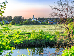 Suzdal, Vladimir region, Russia, Golden Ring - Panorama of the flood meadow and the Church of the Nativity of John the Baptist and the Church of the Epiphany