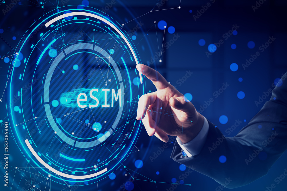Poster close up of male hand pointing at creative glowing esim hologram on blurry office background. embedd