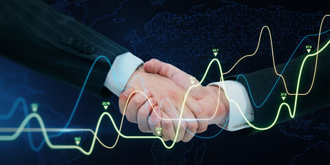 Close up of businessmen shaking hands with growing business graph on dark background. Financial...