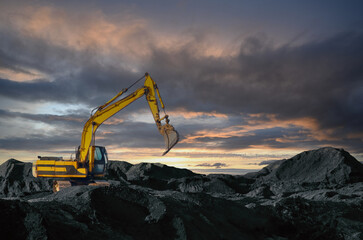 Excavator working on earthmoving at open pit mining. Backhoe digs gravel in quarry. Construction equipment and  machinery for quarrying. Recycling of gravel and concrete construction waste © MaxSafaniuk