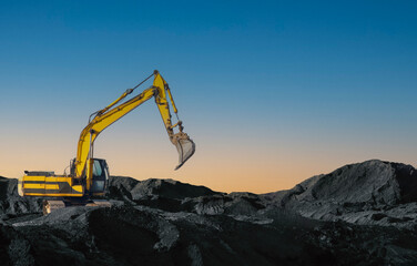 Excavator working on earthmoving at open pit mining. Backhoe digs gravel in quarry. Construction...