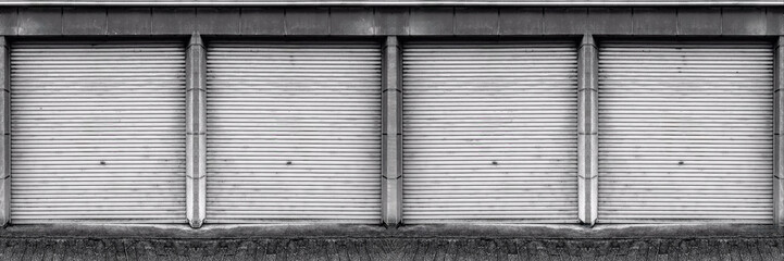 Closed steel shutter door of warehouse, storage or storefront for metal door background and textured.