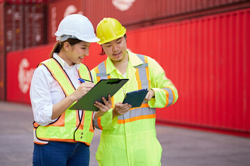 workers or engineers talking about work or project in containers warehouse storage