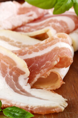 fresh smoked pancetta bacon on wooden table
