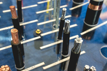 Copper and aluminum cables of various gauges and thickness on display at a hardware.