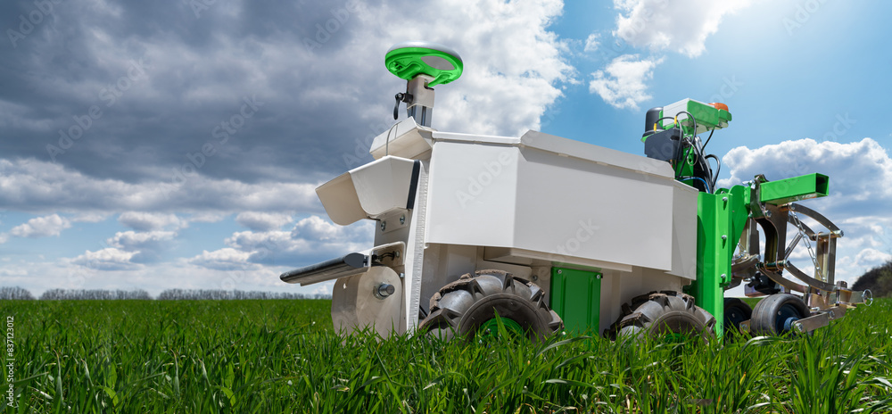 Aufkleber Autonomous wheeled robot is working in an agricultural field. Using artificial intelligence on a smart farm..