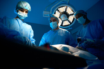 Surgeon performing operation in modern operating room