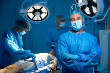 Doctor surgeon in sterile uniform in operating room