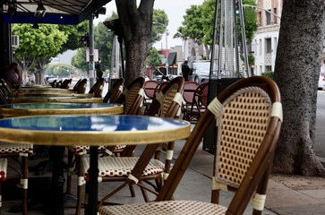 tables and chairs at a sidewalk cafe