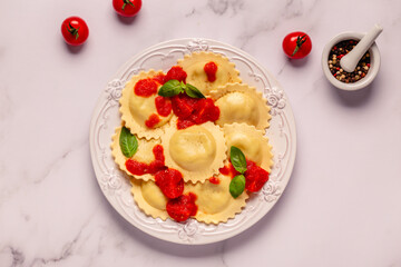 Ravioli with tomato sauce and basil