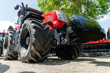 Modern red agricultural tractor bottom view.