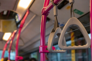 Interior view of the bus with hand grip, in Singapore