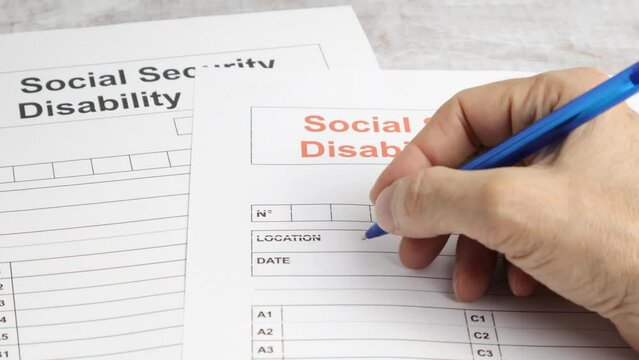 Person Filling Social Security Disability Claim Form