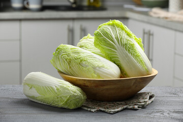 Fresh Chinese cabbages on grey wooden table