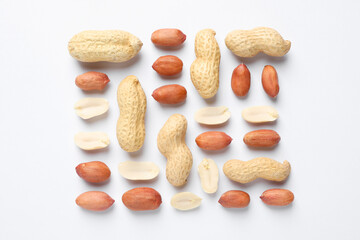 Fresh peanuts on white background, flat lay