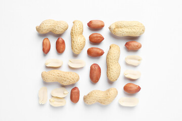 Fresh peanuts on white background, flat lay