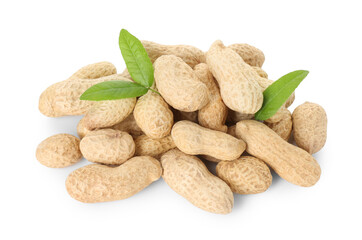 Fresh unpeeled peanuts and green leaves isolated on white