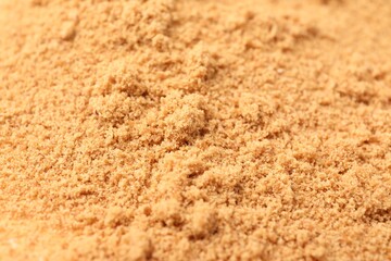 Brown coconut sugar as background, closeup view