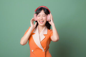 Woman in orange dress listening to music