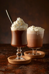 Creamy milk chocolate drinks with whipped cream.
