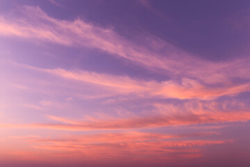 Dramatic soft sunrise, sunset pink violet blue orange sky with cirrus clouds background texture