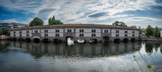 Strasbourg, France - 06 28 2023: Strasbourg city: Panoramic view of Vauban Dam along the Ill river .