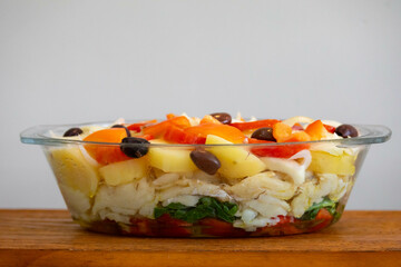 Traditional Portuguese bacalhoada with classic ingredients. When cod Oven