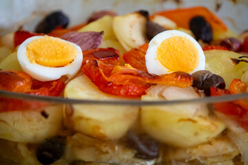 Traditional Portuguese bacalhoada with classic ingredients. When cod Oven