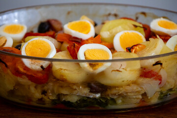 Traditional Portuguese bacalhoada with classic ingredients. When cod Oven
