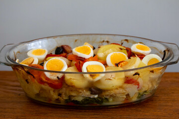 Traditional Portuguese bacalhoada with classic ingredients. When cod Oven
