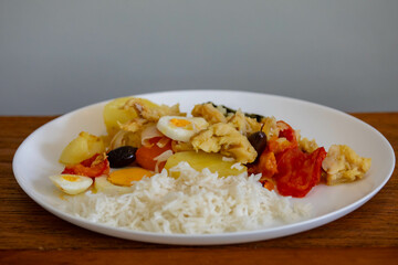Traditional Portuguese bacalhoada with classic ingredients. When cod Oven